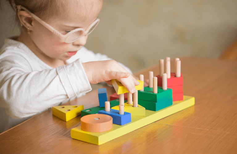  specially abled child playing with toys to enhance skills
